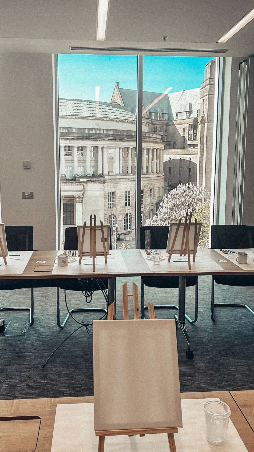 A calm Quiet Thunder workshop space overlooking Manchester Central Library